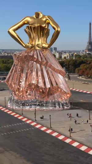 Giant Woman-Shaped Perfume Bottle in a fake-out-of-home ad of Rochas Paris