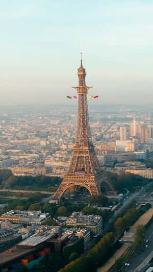 Bubble Sofas Swing Ride on Eiffel Tower in a fake-out-of-home ad of Roche Bobois