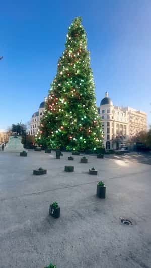 Products Land Before Giant Christmas Tree in a fake-out-of-home ad of Samsung