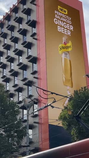 Woman Balances on Tightrope in a fake-out-of-home ad of Shweppes