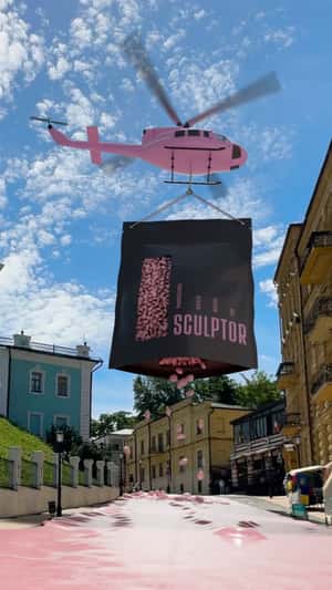 Pink Wax Flows Through Kyiv Streets in a fake-out-of-home ad of Sculptor