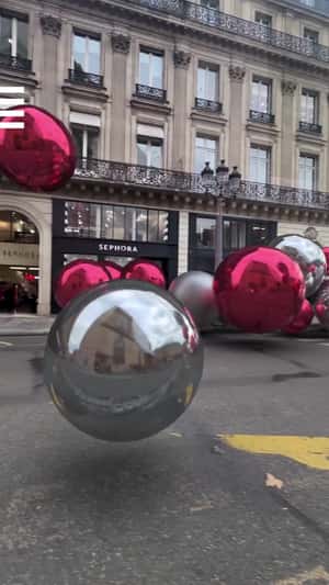 Christmas Ornaments Roll Toward Store in a fake-out-of-home ad of Sephora