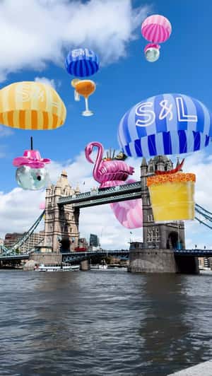 Cocktails Descend Over Tower Bridge in a fake-out-of-home ad of Slug & Lettuce 