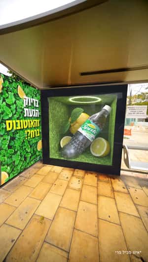 Giant Bottle at Transit Shelter in a fake-out-of-home ad of Sprite