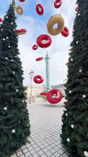 Rain of Giant Donuts in Parisian Square in a fake-out-of-home ad of Starbucks