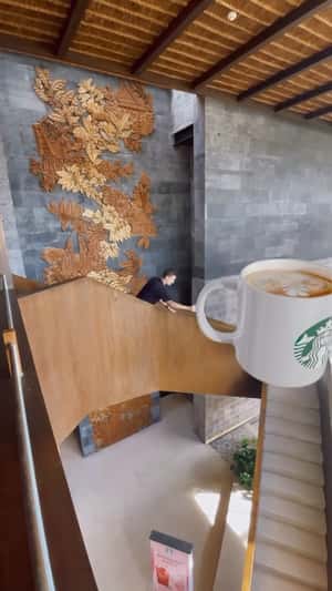 Massive Coffee Cup in Store in a fake-out-of-home ad of Starbucks