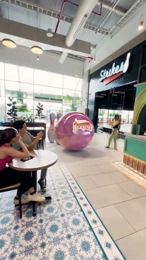 Giant Strikes Bowling Ball in a fake-out-of-home ad of Mall del Sol