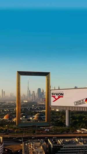 Giant Golden Frame in Dubai Skyline in a fake-out-of-home ad of Sykon