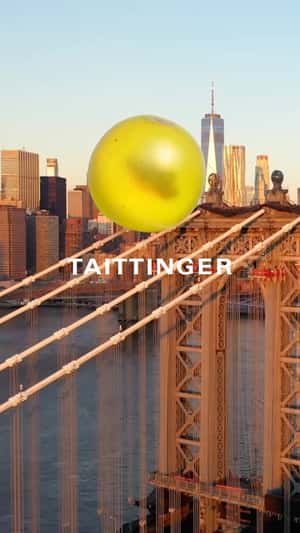 Giant Grape on Manhattan Bridge in a fake-out-of-home ad of Champagne Taittinger