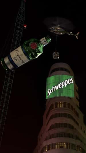 Giant Tanqueray Pour in Building Madrid in a fake-out-of-home ad of Diageo
