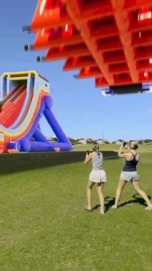 Giant Slide Drop in a Field in a fake-out-of-home ad of The Big Wedgie