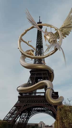 Hunger Games Symbols on Eiffel Tower in a fake-out-of-home ad of Metropolitan Films