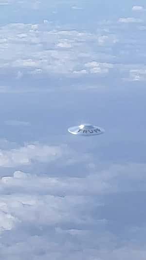 UFO Spotted Above Clouds in a fake-out-of-home ad of Truff