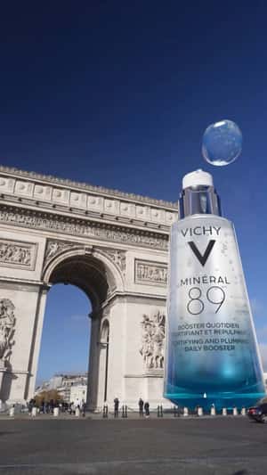 Giant Serum Drops Float At Arc de Triomphe in a fake-out-of-home ad of Vichy Vichy Laboratoires