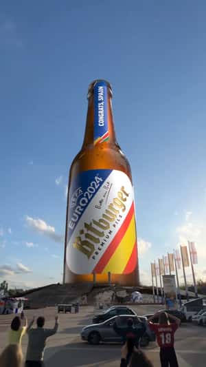 Bottle Emerging at Berlin Stadium in fake-out-of-home ad of Bitburger