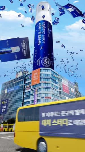 Giant Energy Shot and Confetti in Daechi-dong in a fake-out-of-home ad of Vital Beautie