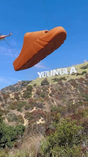 Giant Slide Collapses Into Smaller Slides in a fake-out-of-home ad of YoungLA