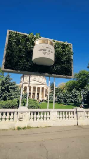 Giant Cream Emerges from Panel in a fake-out-of-home ad of Yves Rocher