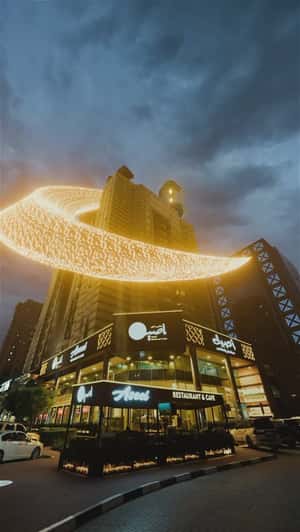 Crescent Moon Falls Over Tower in a fake-out-of-home ad of Aseel Restaurant