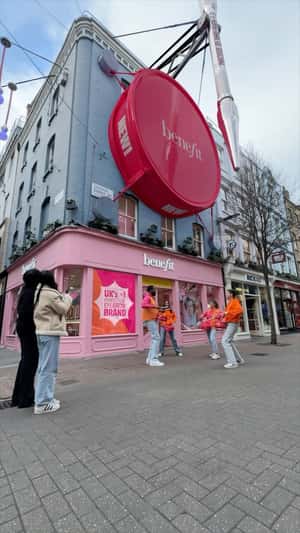 Massive Compact Drum in a fake-out-of-home ad of Benefit Cosmetics