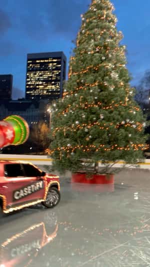 Canon Decorates Giant Christmas Tree in a fake-out-of-home ad of CASETiFY