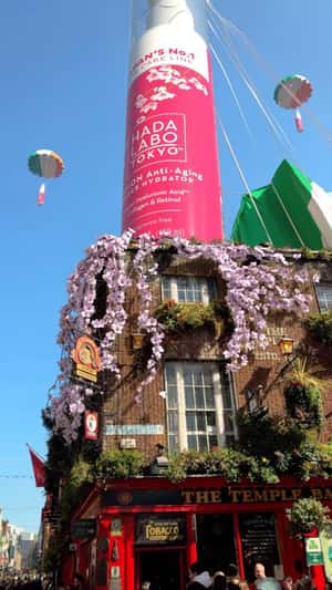 Bottle Over Temple Bar in a fake-out-of-home ad of Hada Laba Tokyo
