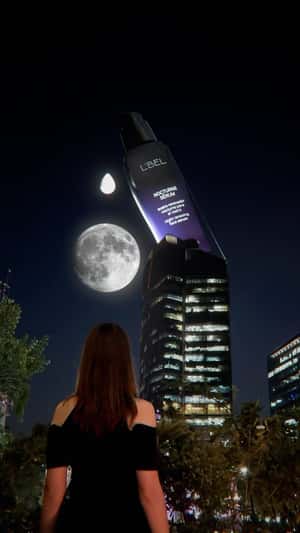 Giant Serum Under the Moonlight in a fake-out-of-home ad of L’Bel