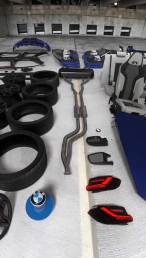 BMW Car Assembled by Button Press in a fake-out-of-home ad of Kies Motorsports