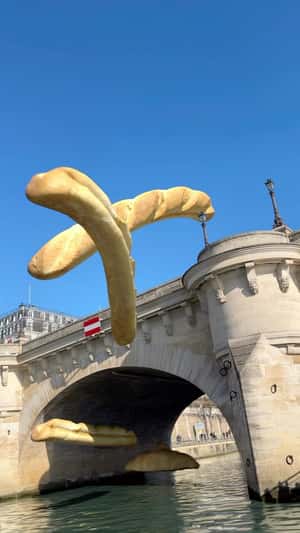 Giant Baguettes Float Over Paris in a fake-out-of-home ad of Lenovo