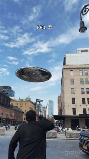 Metallic UFO Lands on NYC Building in a fake-out-of-home ad of Lucid Motors 