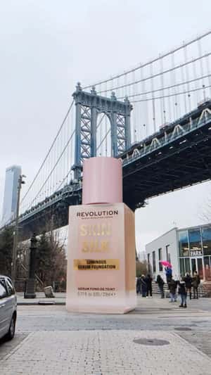 Giant Foundation Beside Manhattan Bridge in a fake-out-of-home ad of Revolution Makeup