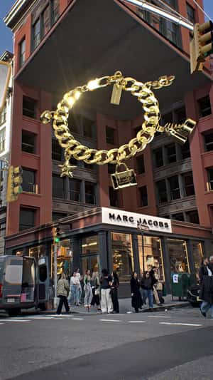 Giant Gold Charm Bracelet Display in a fake-out-of-home ad of Marc Jacobs