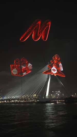 Inflatables Hover Above Erasmus Bridge in a fake-out-of-home ad of MediaMarkt