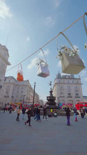 Longchamp Bags Glides on Rope in fake-out-of-home ad of Longchamp