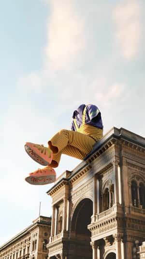 Giant Invisible Figure Wears Knits In Milan in a fake-out-of-home ad of Trimalhas