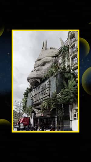 Massive Stone Ape Head in Cinema Facade in a fake-out-of-home ad of Disney