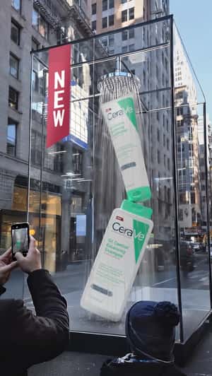 Shower Installation on City Street in a fake-out-of-home ad of CeraVe