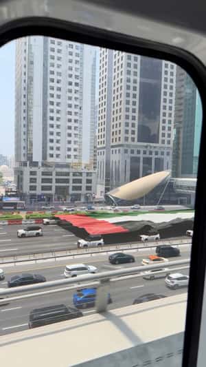 Convoy Carries Giant UAE Flag in a fake-out-of-home ad of Nissan