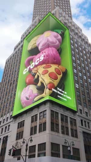 Giant Clog and Jibbitz Inside Glass Case in a fake-out-of-home ad of Crocs