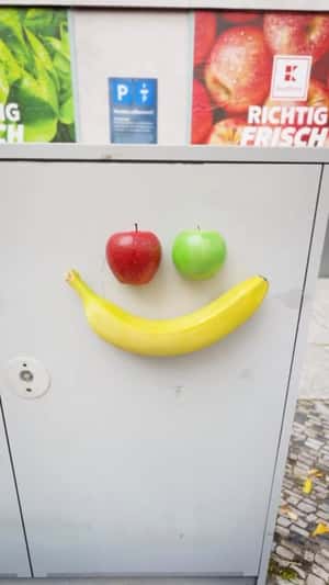 Wrinkled Paper Smiley Reveals Fresh Fruit in a fake-out-of-home ad of Kaufland