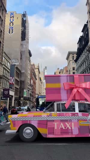 Giant Boxes on Checkered Cabs in a fake-out-of-home ad of Spring & Mulberry 