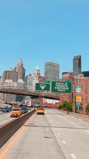 Brand Signage Hangs Above Highway in a fake-out-of-home ad of Prada Beauty