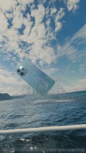 Smartphone Breaching in the Ocean in a fake-out-of-home ad of OPPO