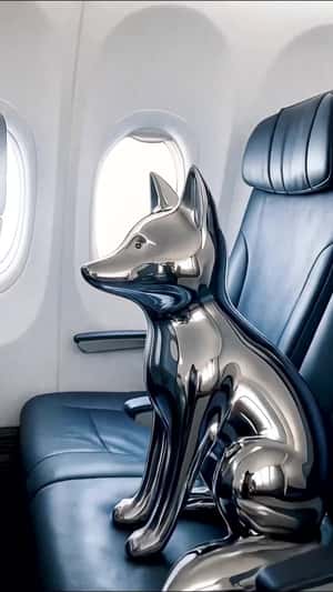 Silver Fox Rides a Plane in a fake-out-of-home ad of Maison Kitsuné