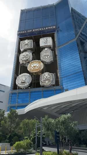 Champ Rings Revealed at Facade in a fake-out-of-home ad of Tom Brady