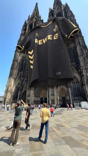 Jersey Hangs at Cologne Cathedral in a fake-out-of-home ad of FCKOELN