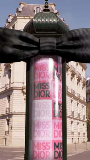 Black Bow Tie on Morris Column in a fake-out-of-home ad of Dior Beauty