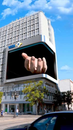 Card in Hand Emerges from Digital Screen in a fake-out-of-home ad of La Poste Tunisienne
