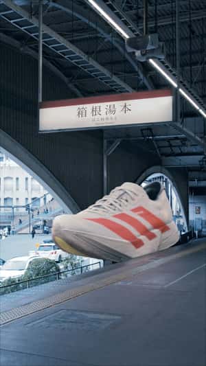 Sneakers Run on Railway in a fake-out-of-home ad of Adidas