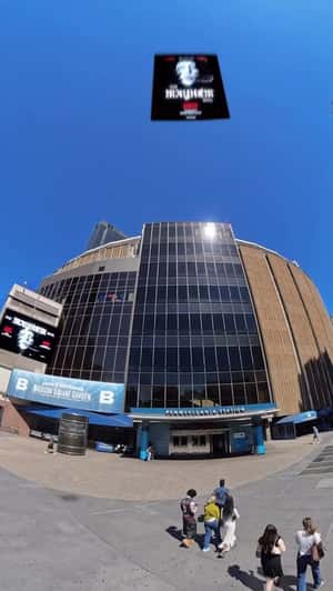Concert Poster Attaches on Facade in a fake-out-of-home ad of Madison Square